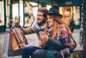 Couple shopping with phone