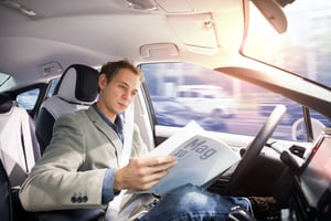Man sitting in self-driving car