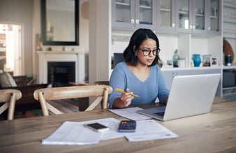 A woman at a desk, working from home